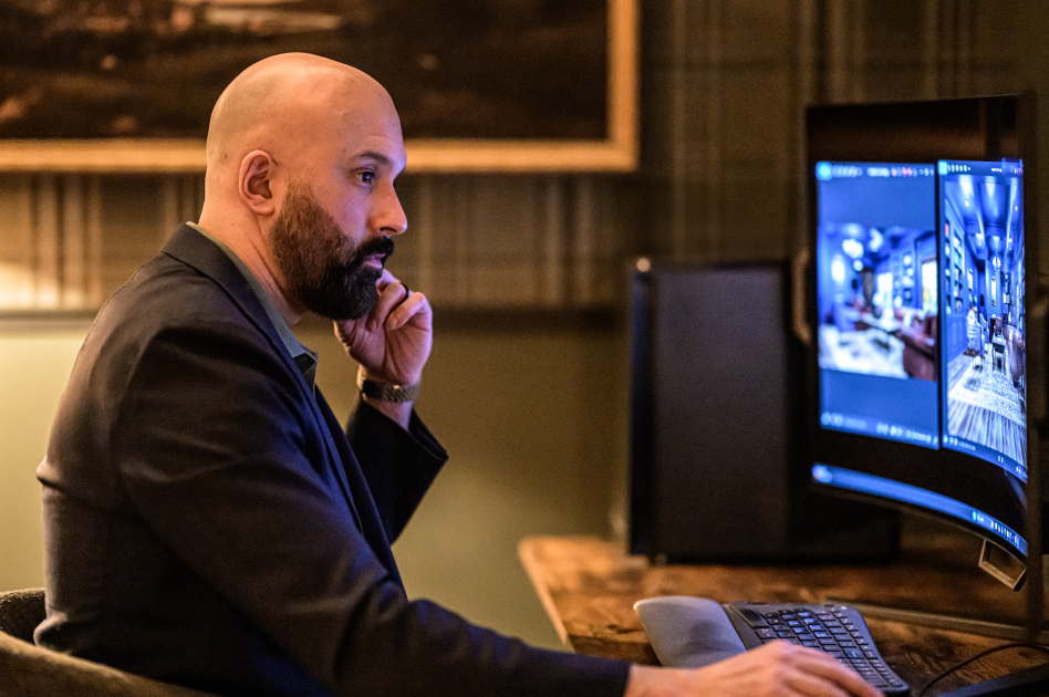 Chaudry Ghafoor reviewing materials and layout for a masculine interior design project